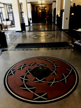 circular image inlaid in floor