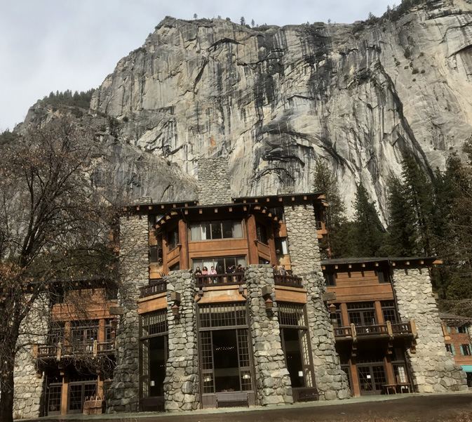 end of building, cliffs behind