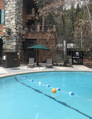 swimming pool with stairs from building showing