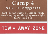 sign says: camp 4 walk-in campground. Parking for Camp 4 campers only. No Camping or sleeping overnight in parking lot. Tow-away zone