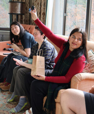 woman holds up small prize