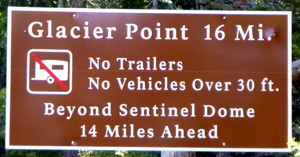 sign says no trailers, no vehicles over 30 feet beyond Sentinel dome 14 miles ahead
