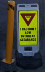 warning sign says caution low overhead clearance