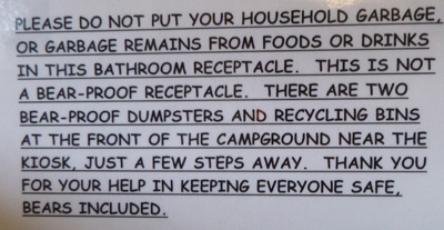 sign says do not put your household trash in bathroom receptacle use nearby dumpsters