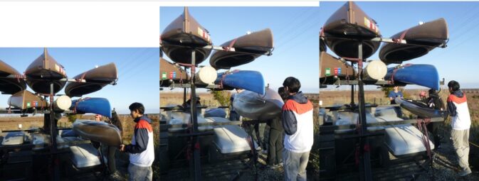 unloading kayaks from a trailer