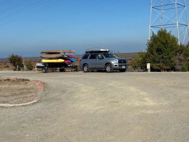 kayak trailer and tow vehicle at end of parking lot