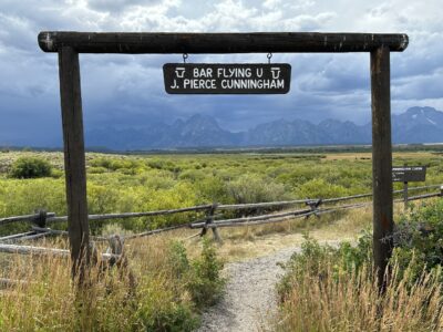ranch style sign says bar flying U