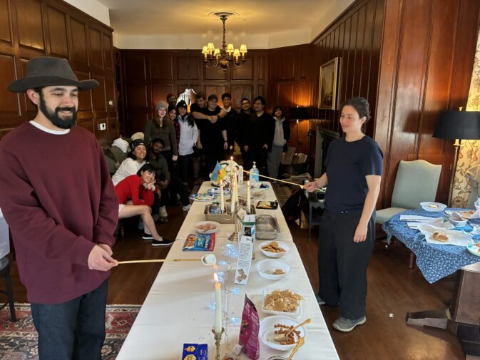 2 people roasting marshmallows