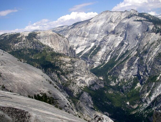 view down into and across Yosemite valley from north dome