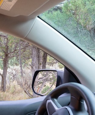 wide pillar to side of windshield