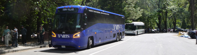 bus stops with two busses