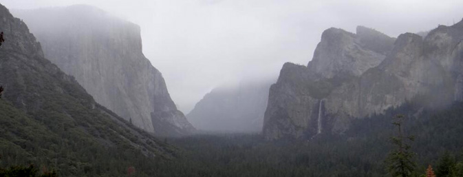 fog hangs low over mountain tops