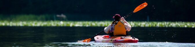 water droplets fall in air of paddle of kayaker