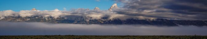 mountain peaks barely showing from cloud bank