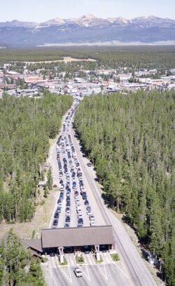 lines of cars extending from entrance station to nearby town.