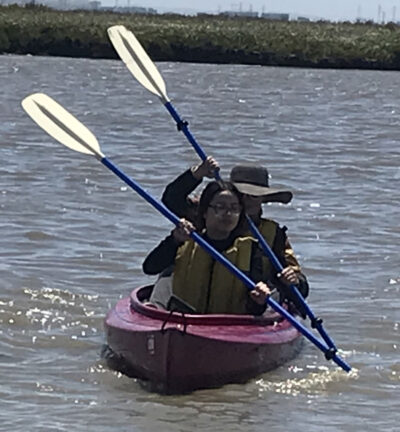 two paddlers with strokes matching