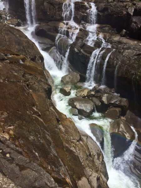 middle cascade Yosemite Falls with hiker who slipped and fell into the water
