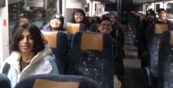smiling people sitting on bus