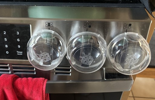 covers on three stove knobs photo by Lauren Tumangan